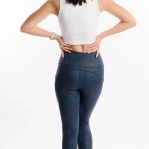 Distressed blue/black leggings with ankle cinch. 7/8 length Never worn